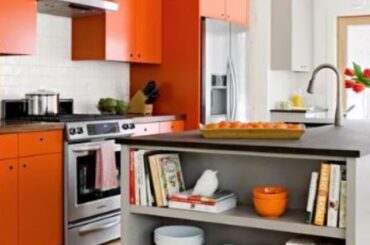 color scheme partners blaze-orange cabinets with a warm gray island